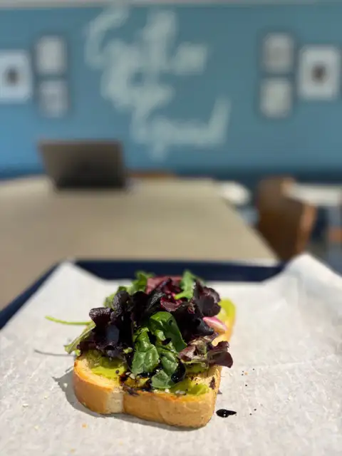 Artisan avocado toast with mixed greens and balsamic drizzle at Second Helpings Café Memphis