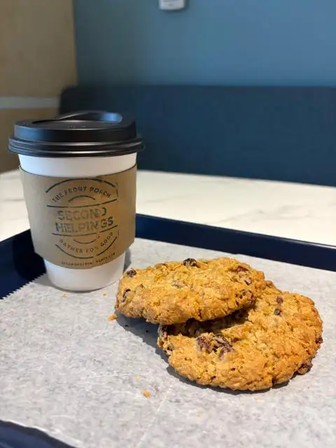 Second Helpings Café branded coffee with fresh-baked oatmeal raisin cookies at The Front Porch Memphis